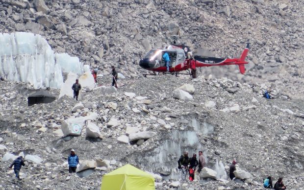April 18, 2014: A Nepalese rescue helicopter lands at Everest Base Camp during rescue efforts following an avalanche that killed 16 Nepalese sherpas in the Khumbu icefall at the base of Mount Everest.