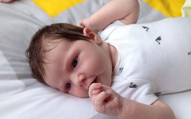 One-month-old Isobel McDougall, who is fed both formula and breast milk.