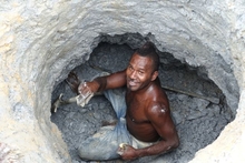 An artisinal gold miner from Nusuta village in Solomon Islands Guadalcanal Province digs for ore in Gold Ridge's pit 3 also known as Kupers.  