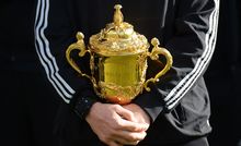 The All Blacks captain Richie McCaw holds the Rugby World Cup. (The Webb Ellis Trophy).