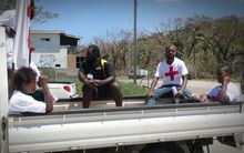 Red Cross workers waiting to distribute aid in Port Vila, Vanuatu after Cyclone Pam