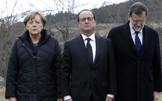 German Chancellor Angela Merkel (L), French President Francois Hollande (C) and Spanish Prime Minister Mariano Rajoy pay their respect to the victims in Seyne-les-Alpes
