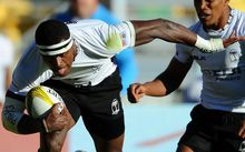 Fiji's Savenaca Rawaca breaks from tackles.