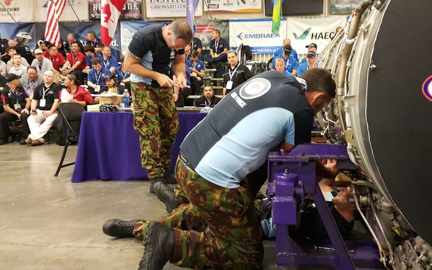 The RNZAF team working on a jet engine during the competition.