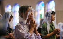People attend a morning mass for victims of the World War II atomic bombing of Nagasaki at the city's Urakami cathedral.