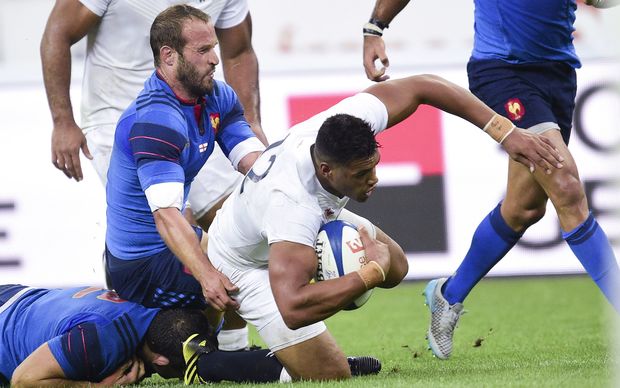 France's Frederic Michalak tackles England's Luther Burrell 