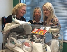 Three of the HPV study authors: Noelyn Hung, Celia Devenish and Tania Slatter in NICU, Dunedin Hospital, with baby Harry William, born prematurely.