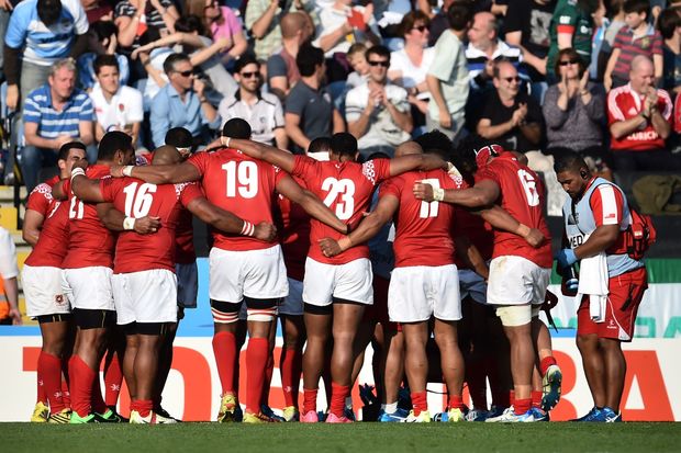 The Tongan team huddle together following their Rugby World Cup defeat to Argentina.