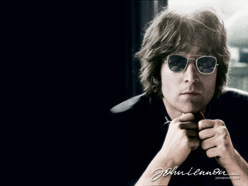 John Lennon posing in sunglasses.