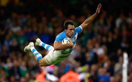 Pumas player Juan Imhoff with a celebratory dive as he scores against Ireland in their World Cup quarterfinal win.