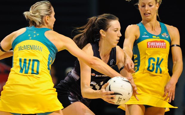 Silver Ferns shooter Bailey Mes battles with Australian defenders Laura Geitz (right) and Claire McMenniman.