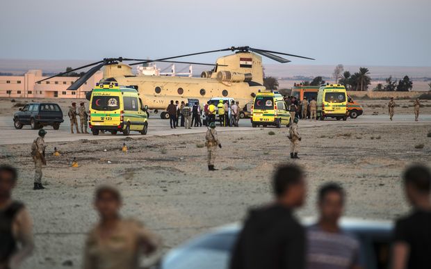 Egyptian ambulances transferring bodies from the crash to a military aircraft at base near the Suez Canal.