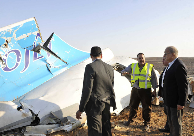 A picture released by Egypt's Prime Minister's office which shows PM Sherif Ismail (right) at the site of the wreckage.