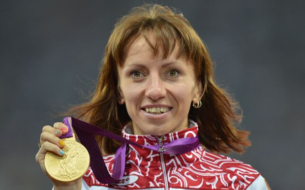 Russia's gold medallist Mariya Savinova celebrating her suspicious women's 800m win at the London 2012 Olympics. AFP PHOTO / JOHANNES EISELE