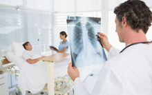Doctor checking X-Ray in hospital (generic).