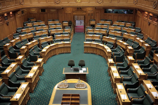 Seats in the empty debating chamber at Parliament 