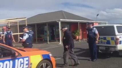 Māori Battalion veteran Selwyn Clarke being taken away by police at Kaitaia Airport.