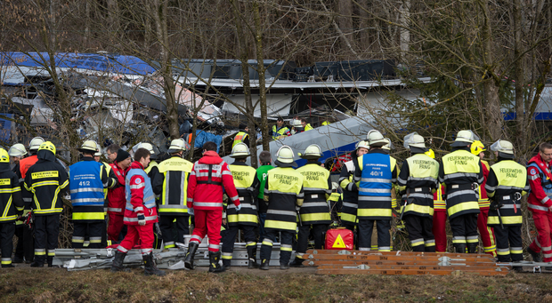 Firefighters and emergency doctors work at the site of a train accident near Bad Aibling, southern Germany, on February 9, 2016. 