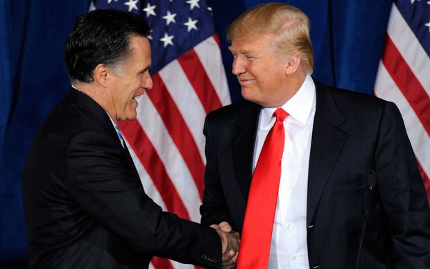 Former Massachusetts governor Mitt Romney shakes Donald Trump's hand in February 2012, when Mr Romney ran his own Presidential race.
