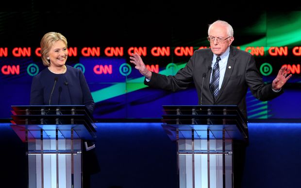 Democratic presidential candidate Senator Bernie Sanders (D-VT) and Democratic presidential candidate Hillary Clinton speak during the CNN Democratic Presidential Primary Debate at the Whiting Auditorium at the Cultural Center Campus on March 6, 2016 in Flint, Michigan.