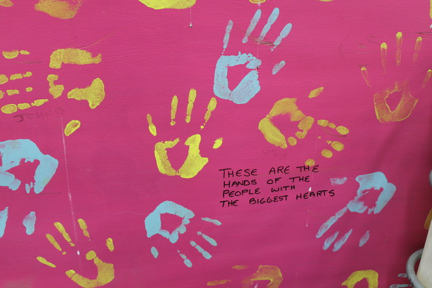 A photo of the handprints of SDE workers on the side of recycling machinery