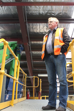 A photo of SDE General Manager, Ian Beker surveying the recycling operation