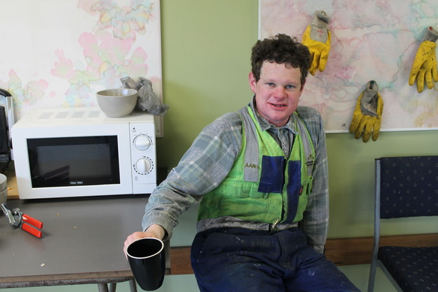 A photo of Aaron Wild taking a coffee break in the canteen