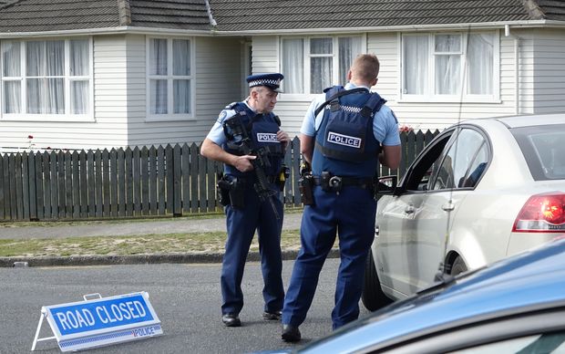 Police have evacuated residents of a Porirua street, north of Wellington, as they hunt for an armed offender who shot dead a police dog.