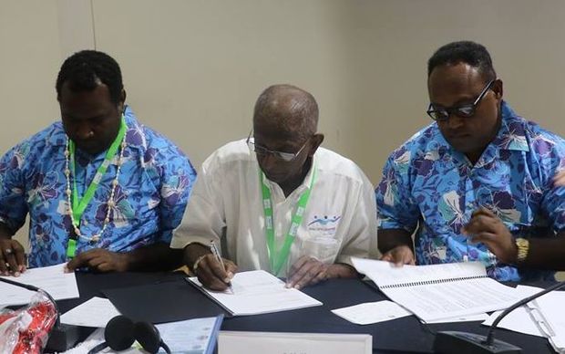 NOCSI President Martin Rara, PGC President Vidhya Lakhan and Solomon Islands Deputy PM Manasseh Maelanga signing the host city contract.