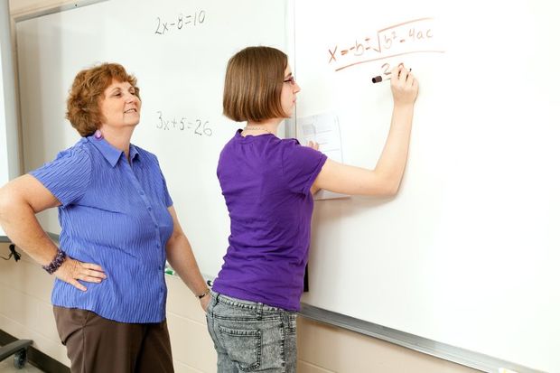 A teacher and student doing maths