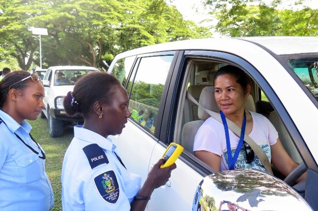 Solomon Islands Police officer about to administer a passive alcohol breath test.