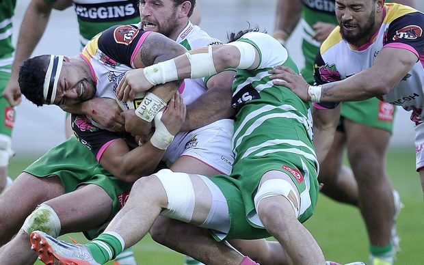 Greg Foe carries the ball strongly for Wellington.