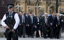 UK MPs leave the Houses of Parliament for a service of remembrance after a special session to honour murdered MP Jo Cox.