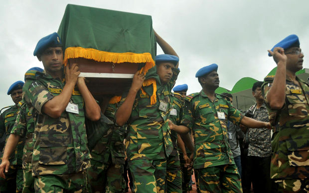 Soldiers carry a coffin during a tribute ceremony to the victims of the 01 July hostage taking at the Holey Artisan Bakery in Dhaka, Bangladesh