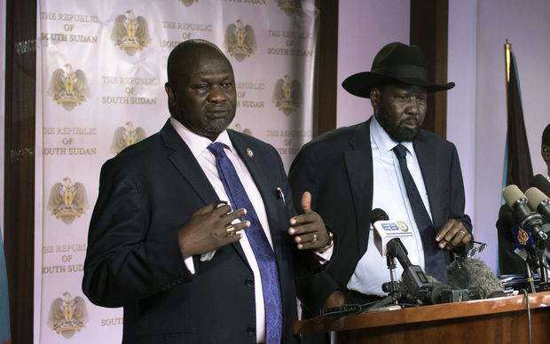 First Vice President Riek Machar (L) delivers a speech to journalists next to South Sudan President Salva Kiir (C) and Vice President James Wani Igga (R) prior to the shooting outside the presidential palace in Juba on July 8, 2016.