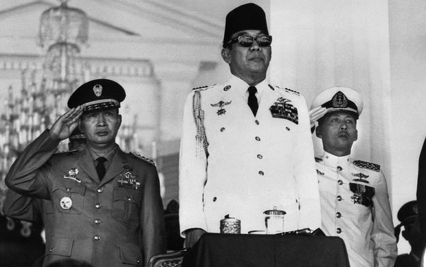 Indonesia's first President, Ahmed Sukarno (C) attends a mass rally in Jakarta in1966.