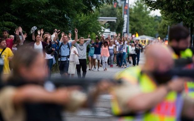 Police evacuate people from the shopping mall in Munich.