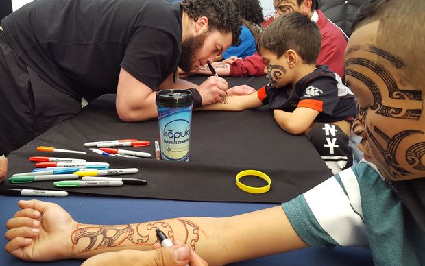 Rangatahi were getting inked up with temporary moko for their performances. 