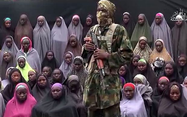 About 50 girls were shown with a gunman who demands the release of Boko Haram fighters.