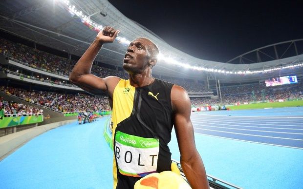 Usain Bolt celebrates after winning the 100m men's sprint at the Rio Olympics.
