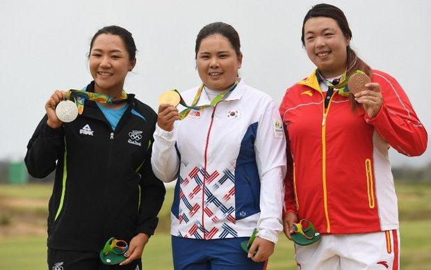 Lydia Ko poses with her with silver medal alongside gold medal winner Park Inbee and bronze winner Feng Shanshan.
