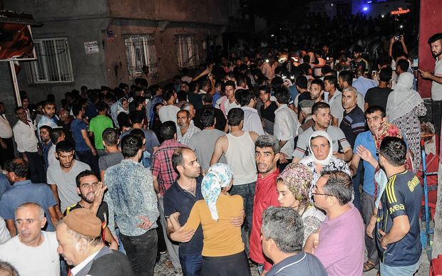 People gather near the explosion site in Gaziantep in the wake of the attack on a wedding party in southeastern Turkey.