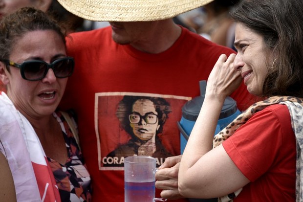 Supporters of impeached Brazilian President Dilma Rousseff react to the Senate vote removing her from office.
