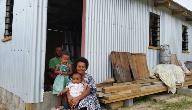 Maraia Waqa with her family and new home.