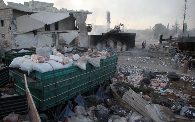 Wreckage of Syrian Red Crescent aid trucks after they were hit by airstrikes at Urum al-Kubra region in Aleppo.