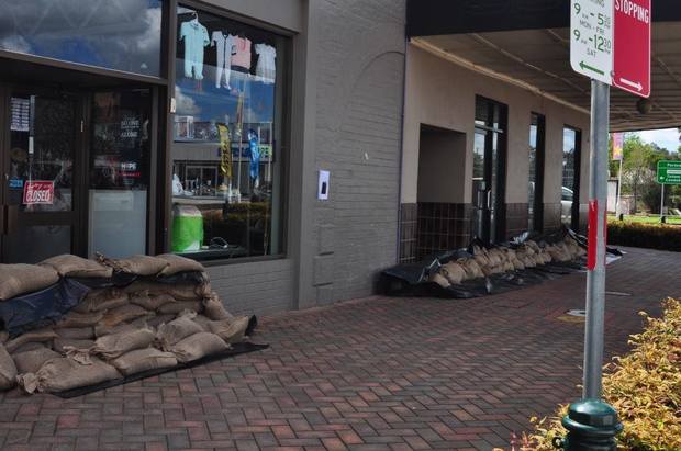 Businesses and homes in Forbes have prepared for flooding by blocking entrances with sandbags.