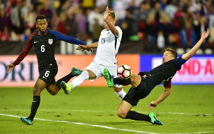The All Whites Monty Patterson contests possession against the United States in Washington DC.