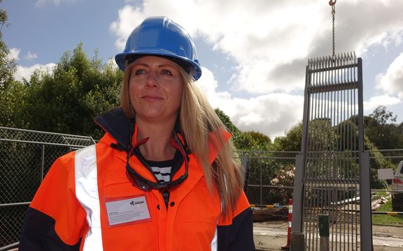 Dunedin City Council infrastructure and networks general manager Ruth Stokes helps install the new pump screen. 