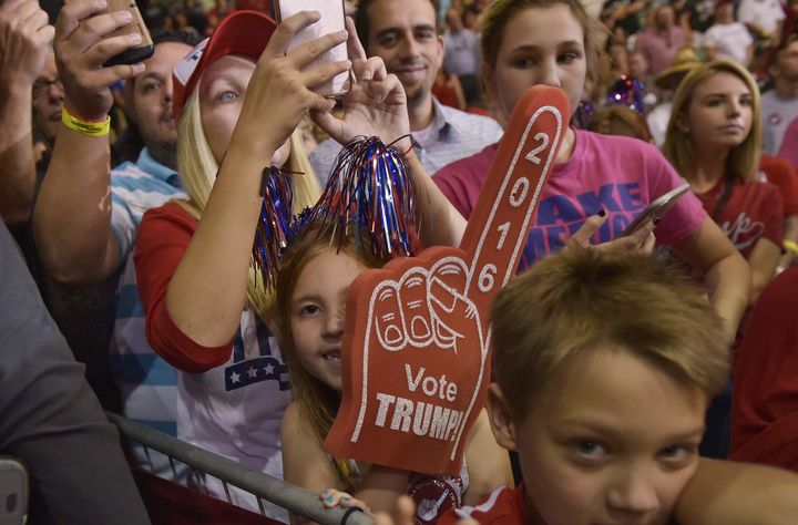 Supporters attend a rally for Republican presidential nominee Donald Trump in the Robarts Arena of the Sarasota Fairgrounds on November 7, 2016 in Sarasota, Florida.