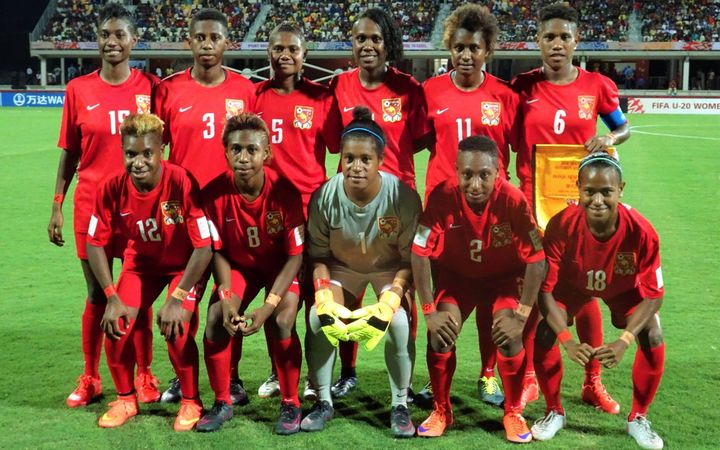 The PNG Under 20 women's team line-up before their World Cup opener against Brazil.